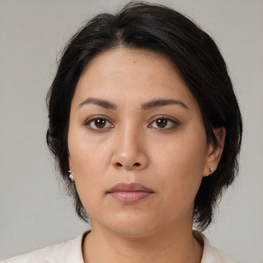 Neutral asian young-adult female with medium  brown hair and brown eyes