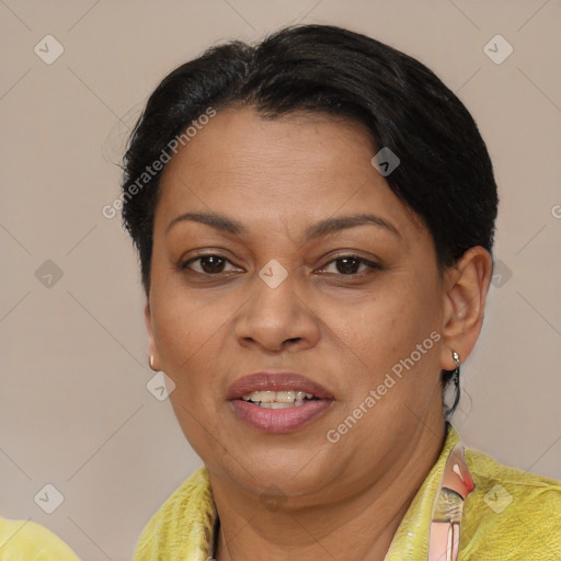 Joyful latino adult female with short  brown hair and brown eyes