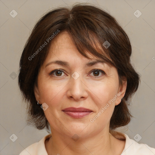 Joyful white adult female with medium  brown hair and brown eyes