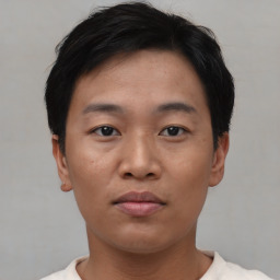 Neutral asian young-adult male with short  brown hair and brown eyes