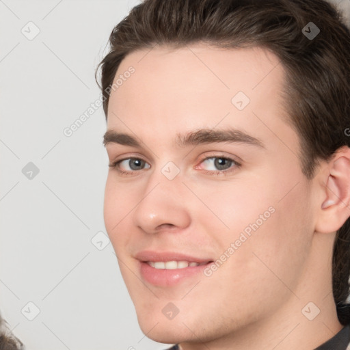 Joyful white young-adult male with medium  brown hair and brown eyes