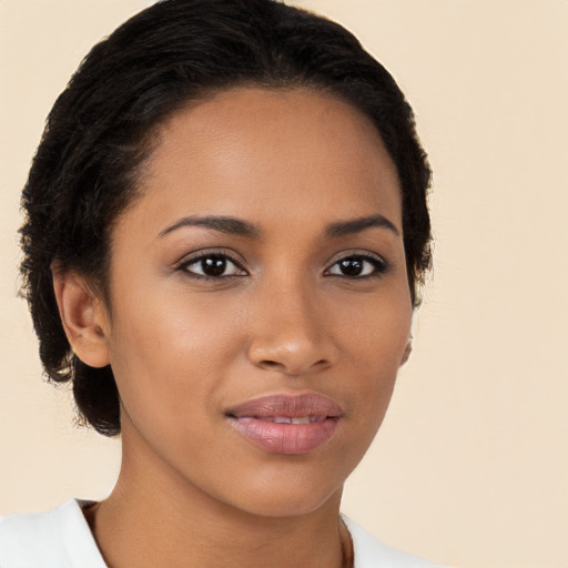 Joyful latino young-adult female with short  brown hair and brown eyes