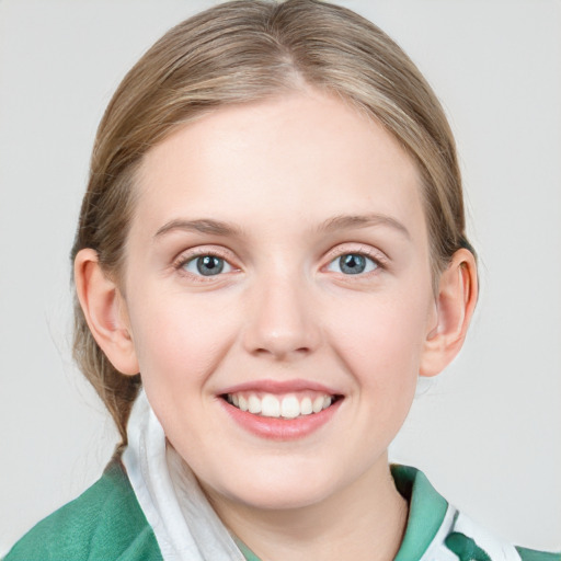 Joyful white young-adult female with medium  brown hair and blue eyes