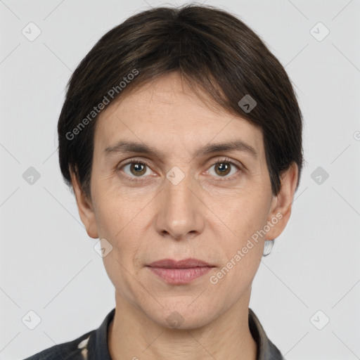 Joyful white adult female with short  brown hair and brown eyes