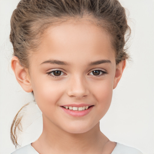 Joyful white child female with short  brown hair and brown eyes