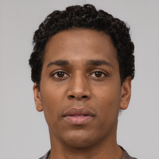 Neutral black young-adult male with short  black hair and brown eyes