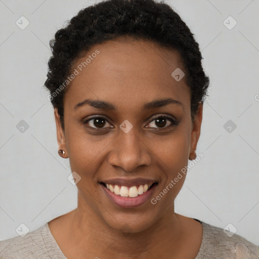 Joyful black young-adult female with short  black hair and brown eyes