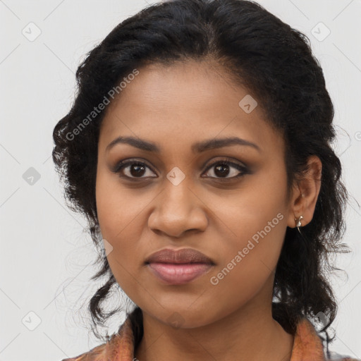 Joyful black young-adult female with long  brown hair and brown eyes