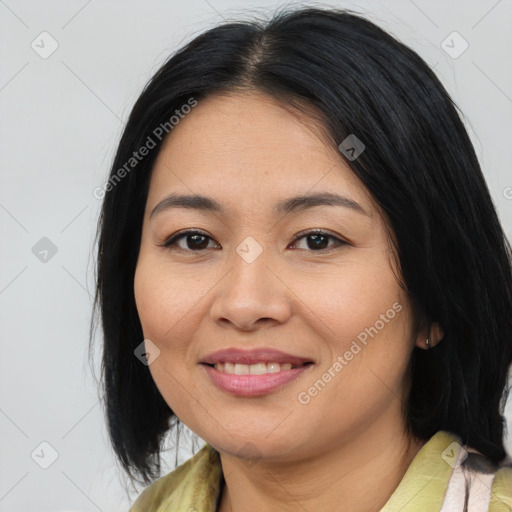 Joyful asian young-adult female with medium  black hair and brown eyes