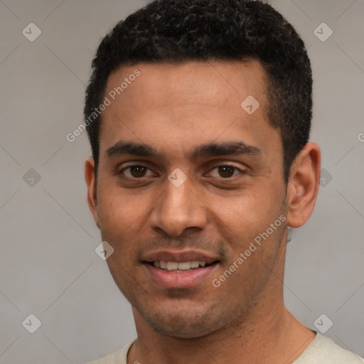 Joyful white young-adult male with short  black hair and brown eyes