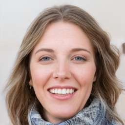 Joyful white young-adult female with medium  brown hair and blue eyes