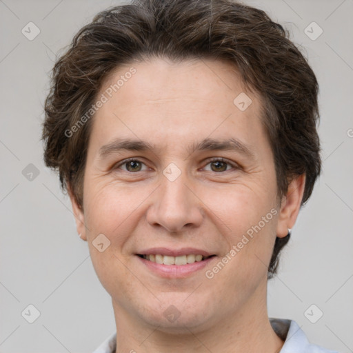 Joyful white adult male with short  brown hair and grey eyes