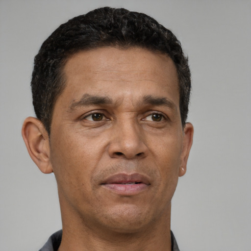 Neutral white adult male with short  black hair and brown eyes