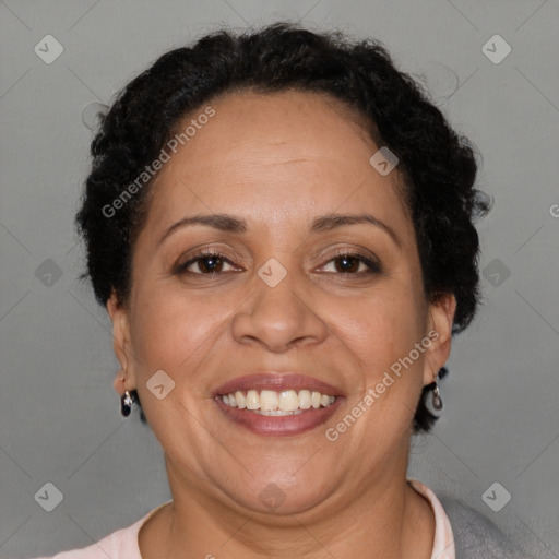 Joyful latino adult female with short  brown hair and brown eyes