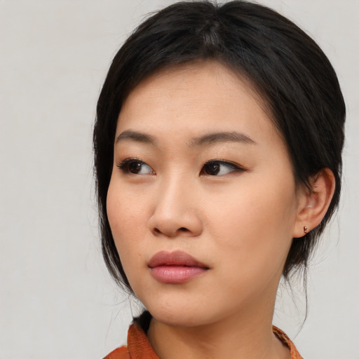 Neutral asian young-adult female with medium  black hair and brown eyes
