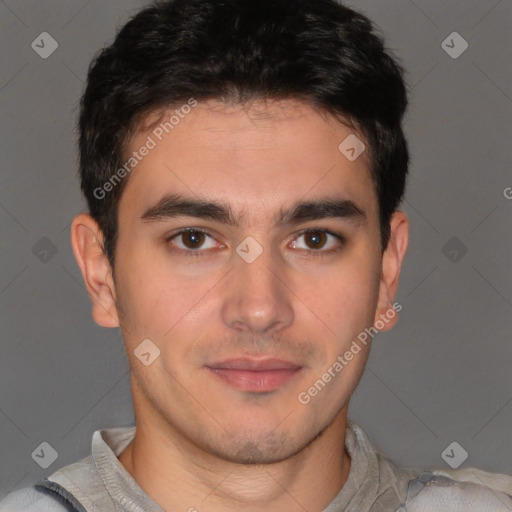 Joyful latino young-adult male with short  brown hair and brown eyes