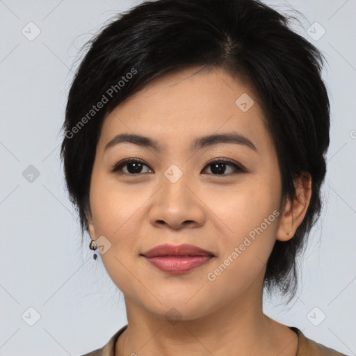 Joyful asian young-adult female with medium  black hair and brown eyes