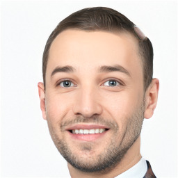 Joyful white young-adult male with short  brown hair and grey eyes