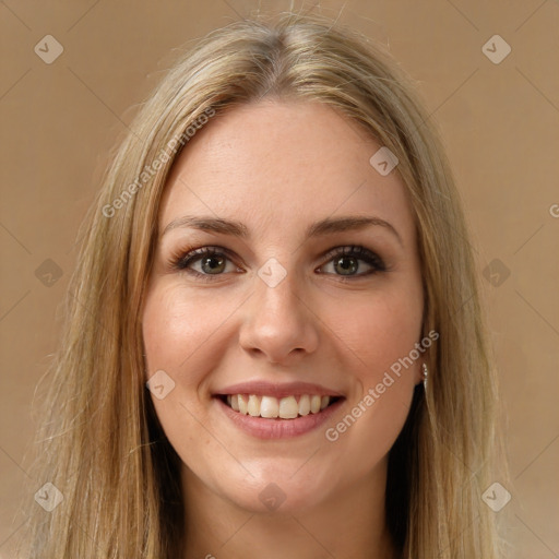 Joyful white young-adult female with long  brown hair and green eyes