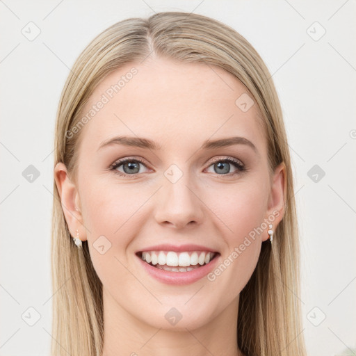 Joyful white young-adult female with long  brown hair and blue eyes