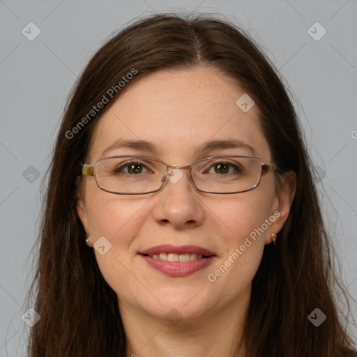 Joyful white adult female with long  brown hair and grey eyes