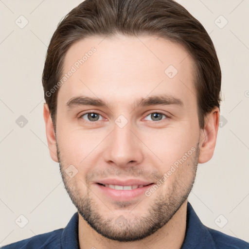 Joyful white young-adult male with short  brown hair and brown eyes