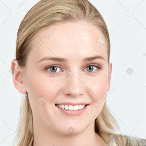 Joyful white young-adult female with long  brown hair and blue eyes