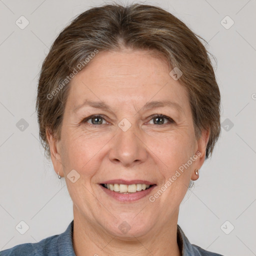 Joyful white adult female with short  brown hair and brown eyes