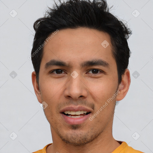 Joyful white young-adult male with short  black hair and brown eyes