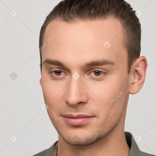 Neutral white young-adult male with short  brown hair and brown eyes