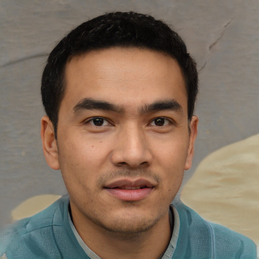 Joyful white young-adult male with short  black hair and brown eyes