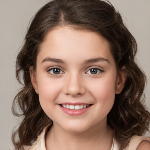 Joyful white child female with medium  brown hair and brown eyes