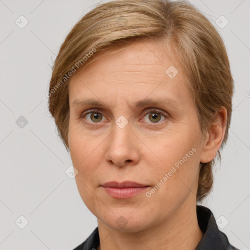 Joyful white adult female with medium  brown hair and grey eyes