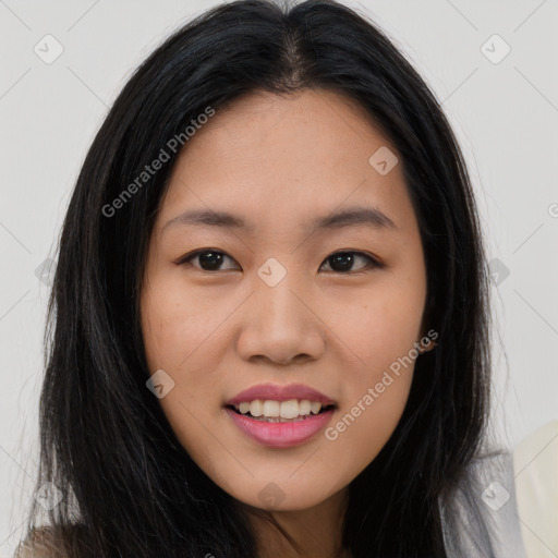 Joyful asian young-adult female with long  brown hair and brown eyes