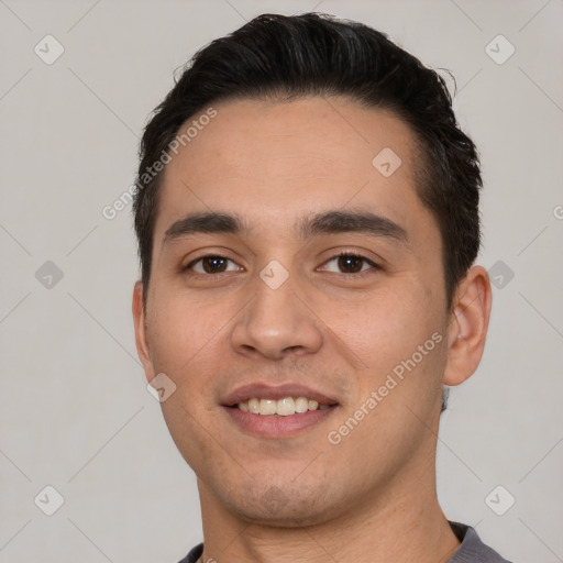 Joyful white young-adult male with short  black hair and brown eyes