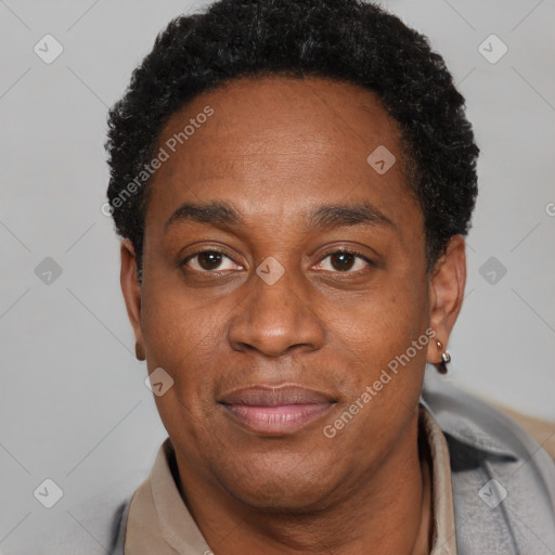 Joyful black adult male with short  black hair and brown eyes