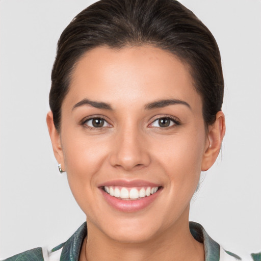 Joyful white young-adult female with medium  brown hair and brown eyes