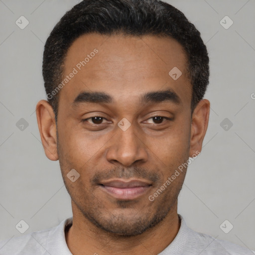 Joyful latino young-adult male with short  black hair and brown eyes