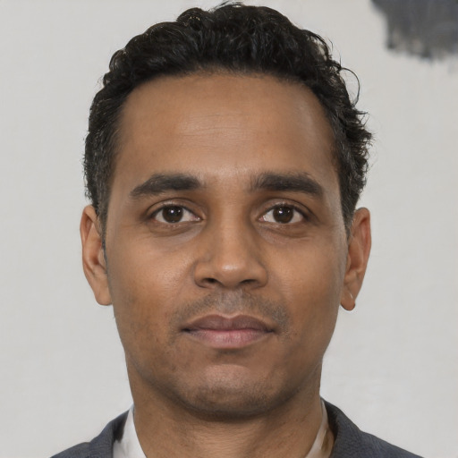 Neutral black young-adult male with short  black hair and brown eyes