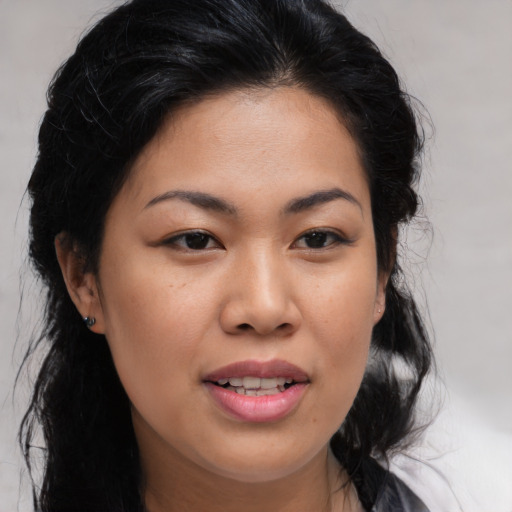 Joyful asian young-adult female with medium  brown hair and brown eyes