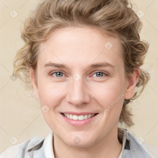 Joyful white young-adult female with medium  brown hair and blue eyes