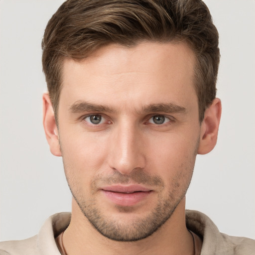 Joyful white young-adult male with short  brown hair and brown eyes