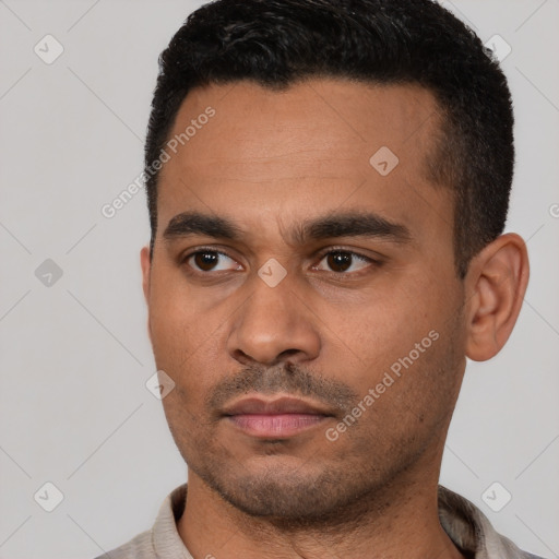 Neutral latino young-adult male with short  black hair and brown eyes