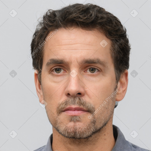 Neutral white adult male with short  brown hair and brown eyes