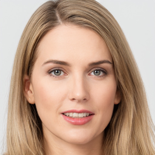 Joyful white young-adult female with long  brown hair and brown eyes