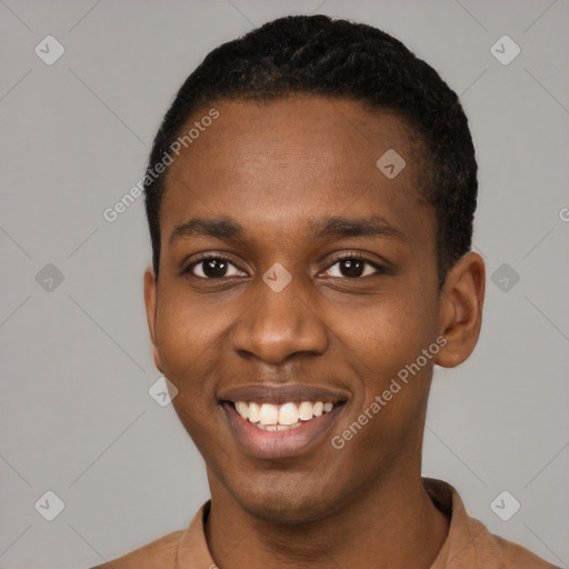 Joyful black young-adult male with short  black hair and brown eyes