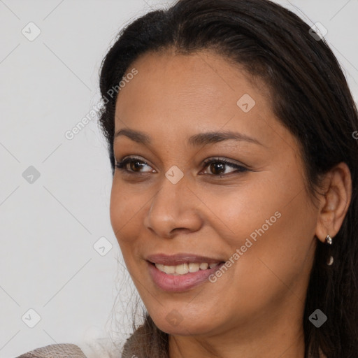 Joyful black young-adult female with medium  brown hair and brown eyes