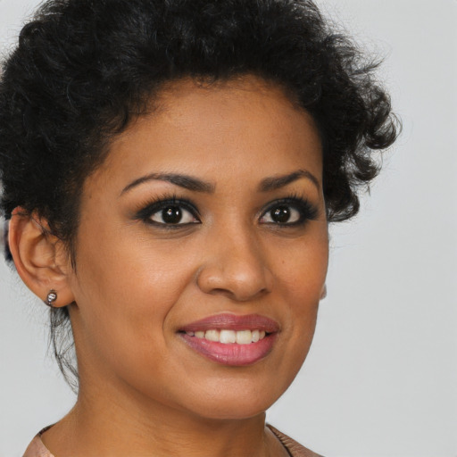 Joyful latino young-adult female with short  brown hair and brown eyes