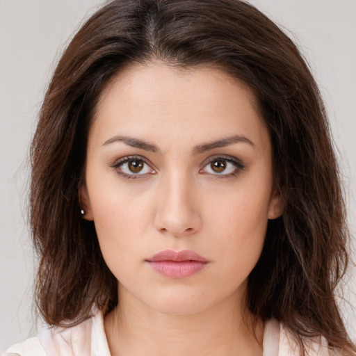 Neutral white young-adult female with medium  brown hair and brown eyes