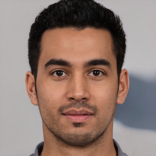 Neutral latino young-adult male with short  black hair and brown eyes